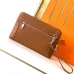 Hermès Leather Zip - Around Wristlet Clutches In Brown And Black With Branded Detailing #A50707
