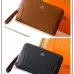 Hermès Leather Zip - Around Wristlet Clutches In Brown And Black With Branded Detailing #A50707