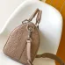Elegant Beige Louis Vuitton Embossed Leather Speedy Bag For Timeless Luxury Travel And Style #A49952