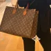 Louis Vuitton Monogram Canvas Handbag With Leather Accents And Tag Design #A53366