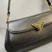 Prada Black Leather Triangle Logo Shoulder Bag: A Symbol of Modern Luxury and Style #A49968