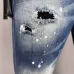 DSQ2 Men's Denim Jeans Edgy Distressed Design with Paint Splatter and Zipper Detail for Fashion Rebels #A54906