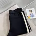 Stylish Loewe Black Track Pants With Contrast Stripes And Branding For Elevated Casual Wear #A25072