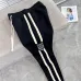 Stylish Loewe Black Track Pants With Contrast Stripes And Branding For Elevated Casual Wear #A25072