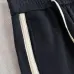 Stylish Loewe Black Track Pants With Contrast Stripes And Branding For Elevated Casual Wear #A25072