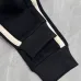 Stylish Loewe Black Track Pants With Contrast Stripes And Branding For Elevated Casual Wear #A25072