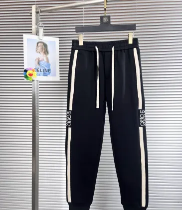 Stylish Loewe Black Track Pants With Contrast Stripes And Branding For Elevated Casual Wear #A25072