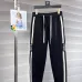 Stylish Loewe Black Track Pants With Contrast Stripes And Branding For Elevated Casual Wear #A25072