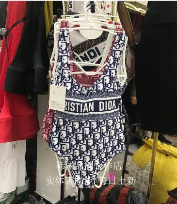 Christian Dior Monogram One - Piece Swimsuits Displayed In Retail Setting For Fashion Seekers #9122044
