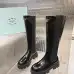Prada's Sleek Black Knee-High Boots Featuring Glossy Texture and Iconic Logo #A54584