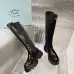 Prada's Sleek Black Knee-High Boots Featuring Glossy Texture and Iconic Logo #A54584