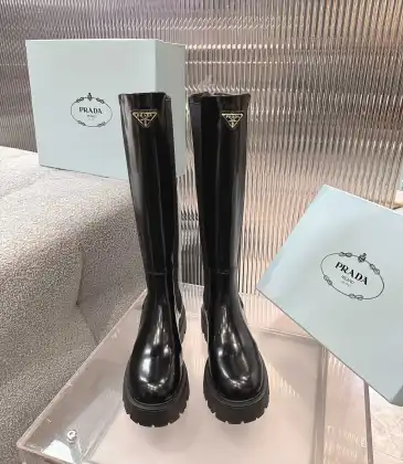 Prada's Sleek Black Knee-High Boots Featuring Glossy Texture and Iconic Logo #A54584