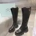 Prada's Stylish Black Lace-Up Knee-High Boots with Chunky Soles on Display #A54585