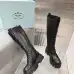 Prada's Stylish Black Lace-Up Knee-High Boots with Chunky Soles on Display #A54585