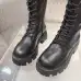 Prada's Stylish Black Lace-Up Knee-High Boots with Chunky Soles on Display #A54585