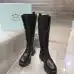 Prada's Stylish Black Lace-Up Knee-High Boots with Chunky Soles on Display #A54585