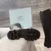 Prada's Stylish Black Lace-Up Knee-High Boots with Chunky Soles on Display #A54585