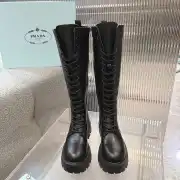 Prada's Stylish Black Lace-Up Knee-High Boots with Chunky Soles on Display #A54585
