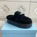 Prada Women's Shearling Lined Mule Slippers Triangle Logo Thick Sole Design for Cozy Luxury Winter Footwear #A57764