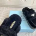 Prada Women's Shearling Lined Mule Slippers Triangle Logo Thick Sole Design for Cozy Luxury Winter Footwear #A57764