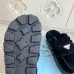 Prada Women's Shearling Lined Mule Slippers Triangle Logo Thick Sole Design for Cozy Luxury Winter Footwear #A57764