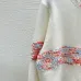 2025 Chanel White Knit Sweater with Colorful Tweed Stripe and CC Logo #A54553