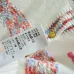 2025 Chanel White Knit Sweater with Colorful Tweed Stripe and CC Logo #A54553