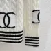 CHANEL Women's Luxury Cable Knit Cardigan  Featuring Bold Signature Double C Logo Intarsia and Contrast Striped Trims #A56341
