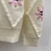 Chanel Women's Knitted Sweaters: Floral   CC Logo Embroidery with Argyle Design for Luxury Fashion Lovers #A56299