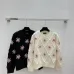 Chanel Women's Knitted Sweaters: Floral   CC Logo Embroidery with Argyle Design for Luxury Fashion Lovers #A56299